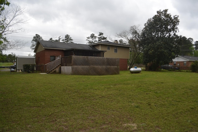 view of yard featuring a sunroom