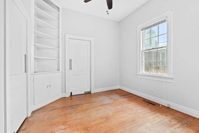 unfurnished bedroom featuring ceiling fan and light hardwood / wood-style flooring