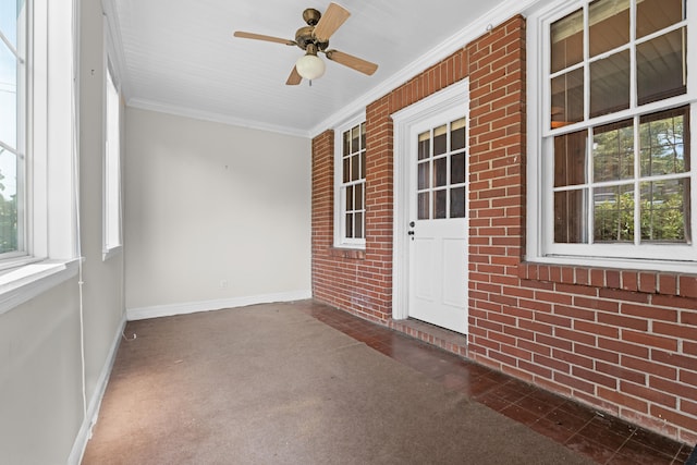 unfurnished sunroom with plenty of natural light and ceiling fan