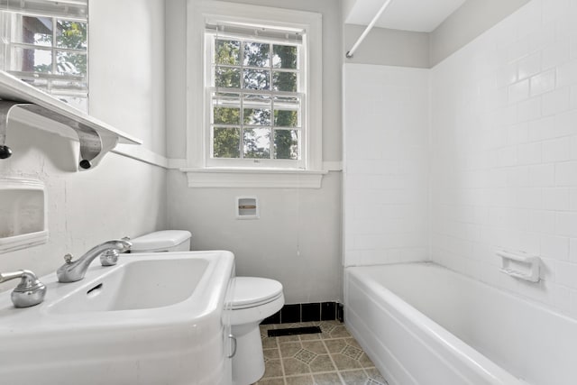 full bathroom with sink, shower / bathing tub combination, and toilet