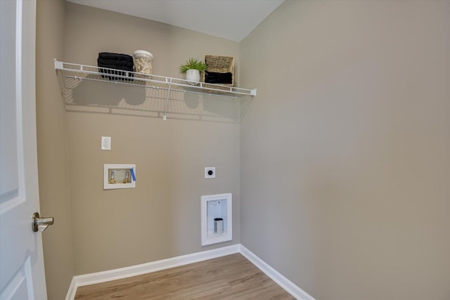 clothes washing area with wood-type flooring, hookup for a washing machine, and electric dryer hookup