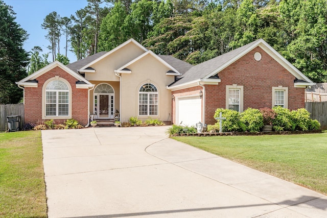 721 Spalding Ct, Martinez, GA 30907 - view of front facade featuring driveway, a garage, brick siding, stucco siding, and roof with shingles