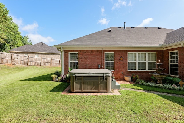 721 Spalding Ct, Martinez, GA 30907 - rear view of property with a hot tub, brick siding, and a shingled roof