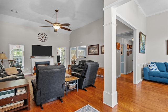 721 Spalding Ct, Martinez, GA 30907 - living room featuring ceiling fan, light wood-type flooring, a fireplace, baseboards, and ornate columns