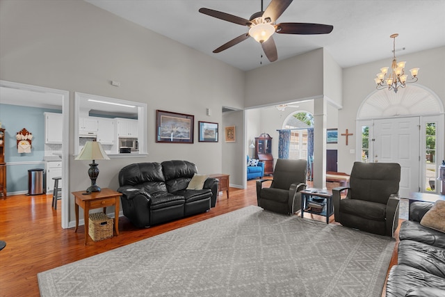 721 Spalding Ct, Martinez, GA 30907 - living room with a high ceiling, wood finished floors, a ceiling fan, a chandelier, and baseboards
