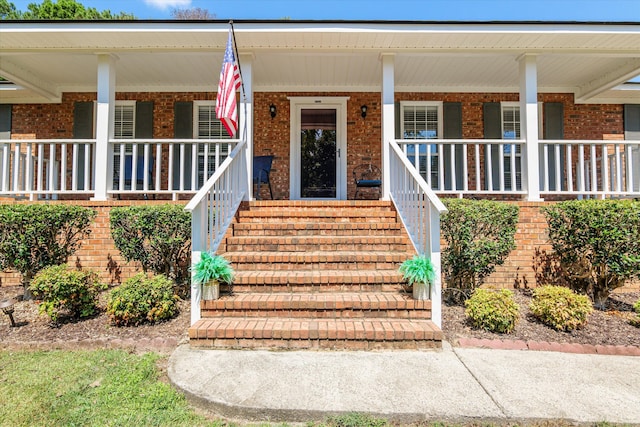 entrance to property with covered porch