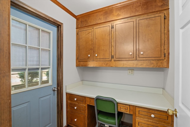 office featuring crown molding and built in desk