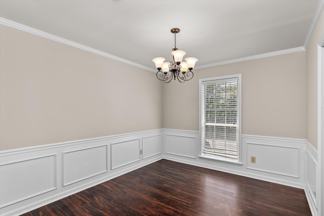 empty room with dark hardwood / wood-style floors, crown molding, and a notable chandelier