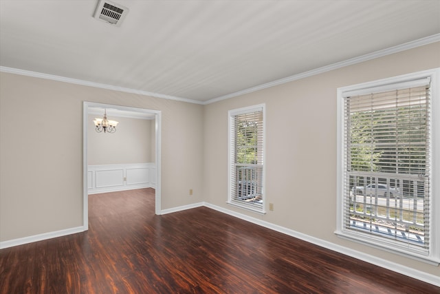 unfurnished room with ornamental molding, dark wood-type flooring, a wealth of natural light, and a notable chandelier