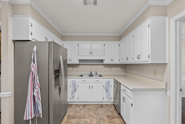 kitchen with white cabinetry, sink, appliances with stainless steel finishes, and ornamental molding