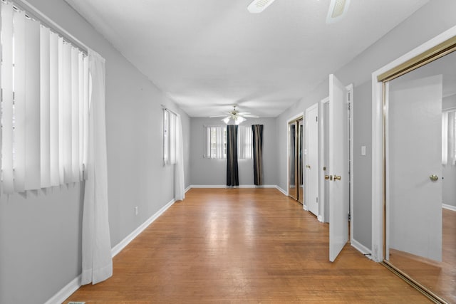 entrance foyer featuring ceiling fan and light hardwood / wood-style flooring