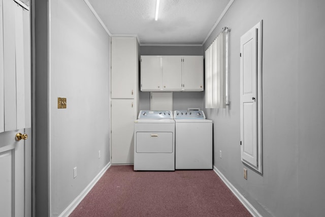 clothes washing area with cabinets, carpet flooring, ornamental molding, a textured ceiling, and washing machine and dryer