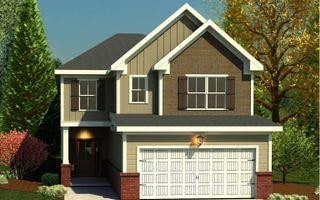 craftsman inspired home featuring an attached garage, driveway, and board and batten siding