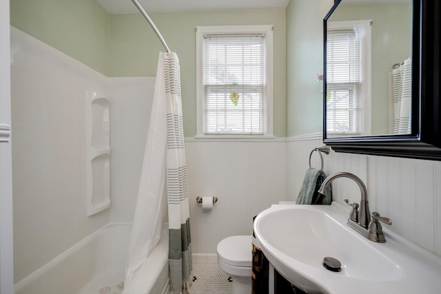 1730 Kissingbower Rd, Augusta, GA 30904 - bathroom featuring wainscoting, shower / bath combination with curtain, and tile patterned flooring