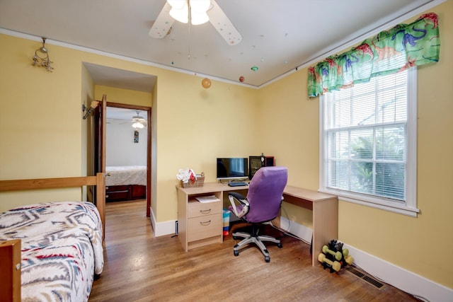 1730 Kissingbower Rd, Augusta, GA 30904 - bedroom with wood finished floors, crown molding, a desk, and ceiling fan