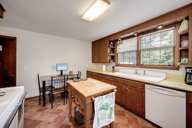 1730 Kissingbower Rd, Augusta, GA 30904 - kitchen featuring white appliances, open shelves, brown cabinetry, and butcher block counters