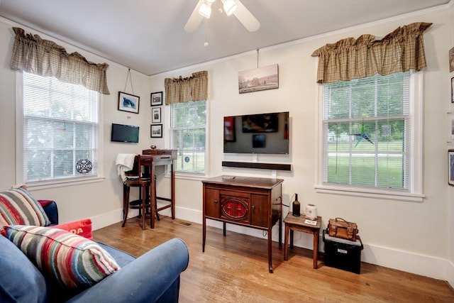 1730 Kissingbower Rd, Augusta, GA 30904 - living area featuring wood finished floors, a ceiling fan, and ornamental molding