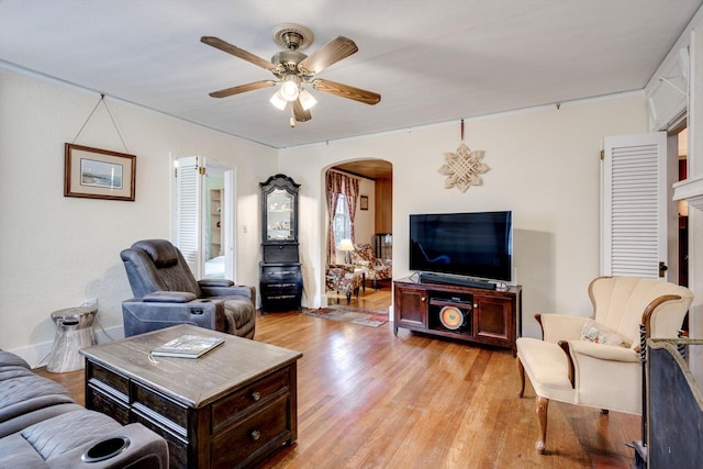 1730 Kissingbower Rd, Augusta, GA 30904 - living area with arched walkways, ceiling fan, and light wood-style floors