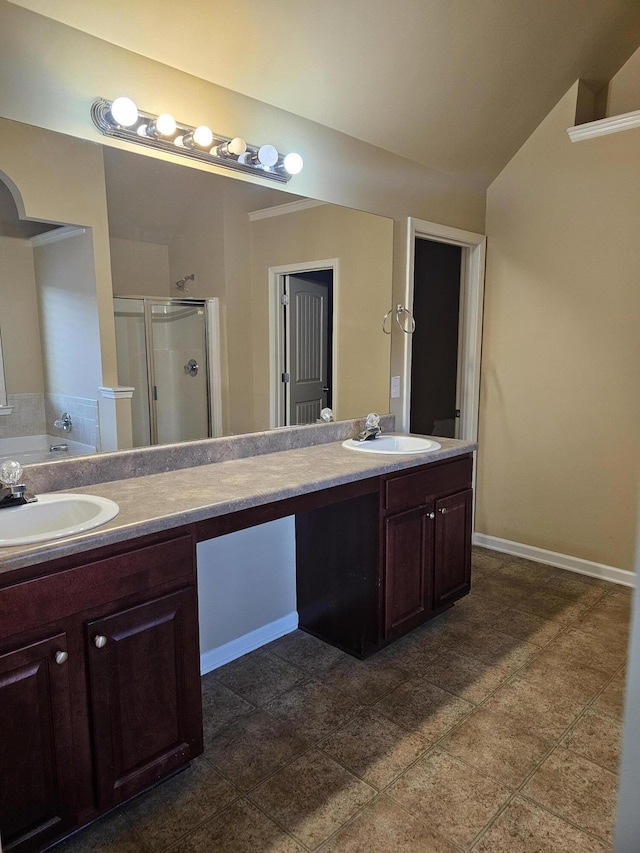 bathroom with a sink, a shower stall, a bath, and double vanity