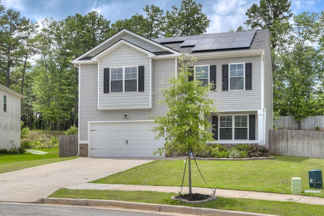 6093 Whitewater Dr, North Augusta, SC 29841 - view of front of property with solar panels, a garage, concrete driveway, and stone siding