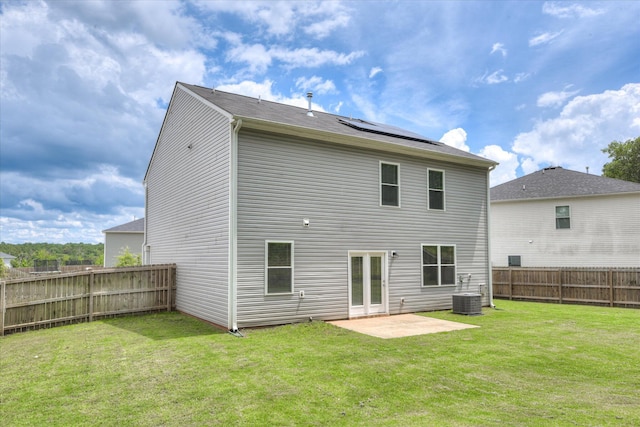 6093 Whitewater Dr, North Augusta, SC 29841 - back of property featuring a fenced backyard, a patio area, and roof mounted solar panels