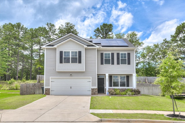 6093 Whitewater Dr, North Augusta, SC 29841 - view of front of home featuring an attached garage, driveway, and roof mounted solar panels