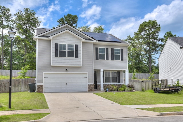 6093 Whitewater Dr, North Augusta, SC 29841 - view of front facade featuring a garage, roof mounted solar panels, driveway, and stone siding