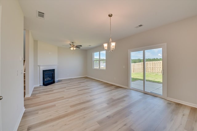 212 Quick Silver Ct, Graniteville, SC 29829 - unfurnished living room featuring light wood-type flooring, ceiling fan, and a fireplace with flush hearth