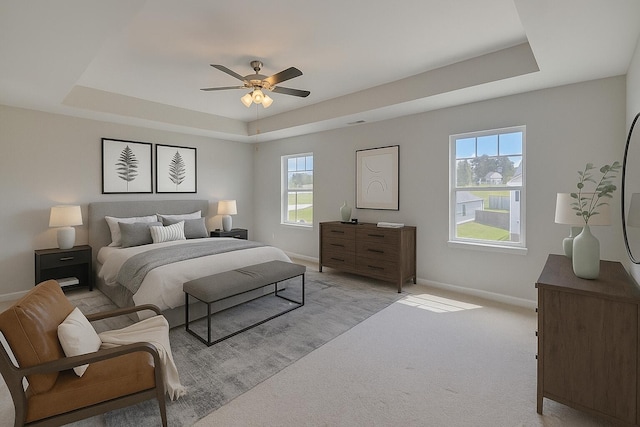 212 Quick Silver Ct, Graniteville, SC 29829 - bedroom featuring a tray ceiling, multiple windows, light carpet, and ceiling fan