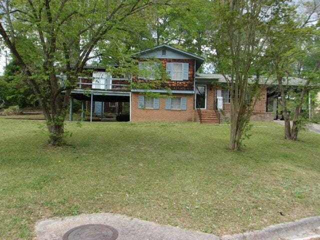 view of yard featuring a wooden deck