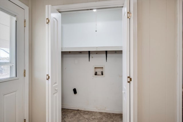 laundry room featuring hookup for a washing machine and light tile patterned floors