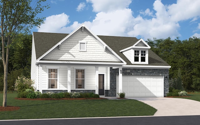 view of front of house featuring a garage and a front lawn