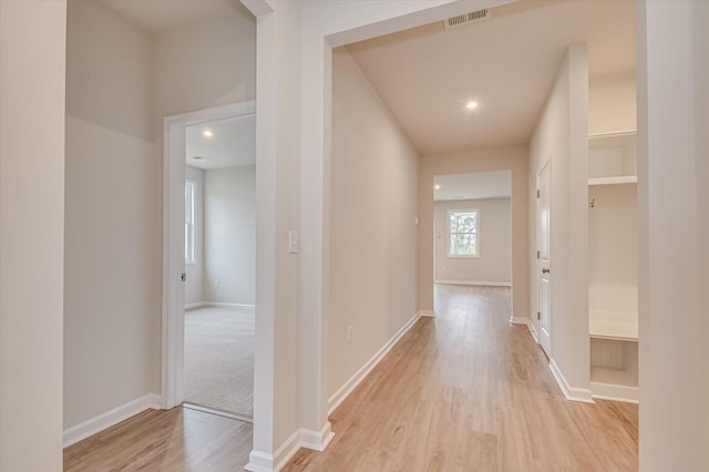 corridor featuring light hardwood / wood-style flooring