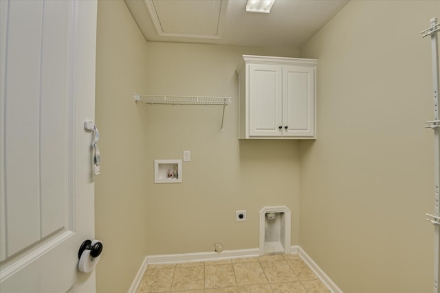 laundry room featuring electric dryer hookup, light tile patterned floors, cabinet space, washer hookup, and baseboards