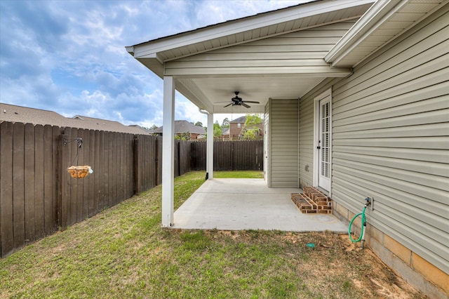 view of yard featuring a ceiling fan, entry steps, a patio, and a fenced backyard