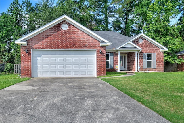 1869 Heathers Way, Augusta, GA 30906 - view of front facade with brick siding, driveway, a front yard, and a garage