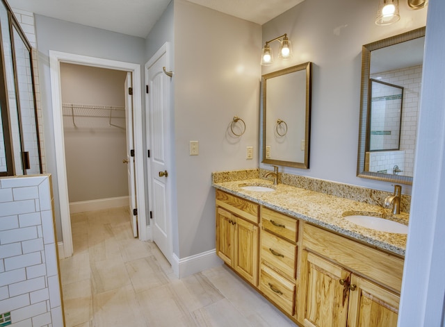 1423 Edgefield Rd, North Augusta, SC 29860 - full bathroom featuring double vanity, a tile shower, and a walk in closet