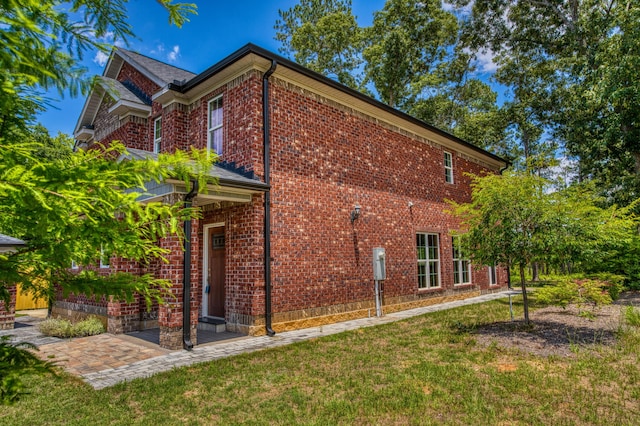 1423 Edgefield Rd, North Augusta, SC 29860 - view of home's exterior featuring brick siding and a yard
