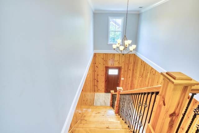 1423 Edgefield Rd, North Augusta, SC 29860 - stairs with a chandelier, wooden walls, and crown molding