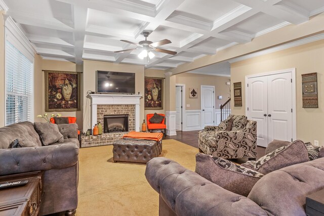 5726 Whispering Pines Way, Evans, GA 30809 - living room featuring beam ceiling, ceiling fan, coffered ceiling, crown molding, and a fireplace