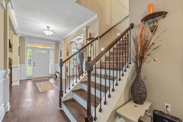 5726 Whispering Pines Way, Evans, GA 30809 - foyer featuring ornamental molding, wood finished floors, a wainscoted wall, a decorative wall, and stairs