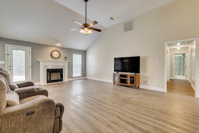 198 Eagle Lake Rd, North Augusta, SC 29841 - living room featuring ceiling fan, light wood-style flooring, a tile fireplace, high vaulted ceiling, and attic access