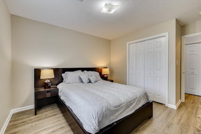 198 Eagle Lake Rd, North Augusta, SC 29841 - bedroom with light wood-style flooring, a closet, and a textured ceiling