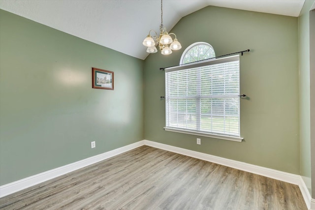 198 Eagle Lake Rd, North Augusta, SC 29841 - spare room featuring lofted ceiling, a chandelier, and wood finished floors