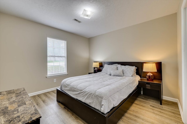 198 Eagle Lake Rd, North Augusta, SC 29841 - bedroom featuring light wood-style floors and a textured ceiling
