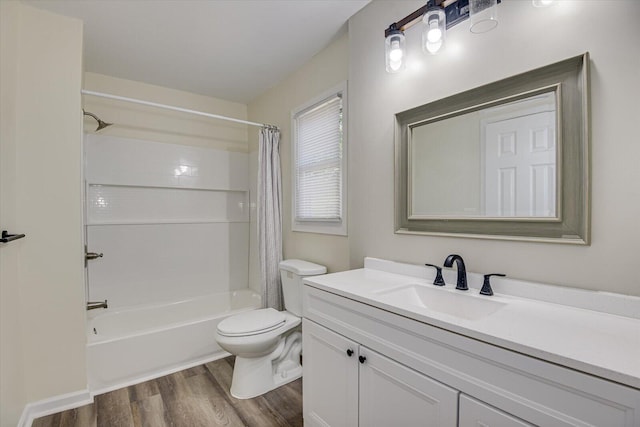 full bath featuring toilet, vanity, wood finished floors, and shower / bath combination with curtain