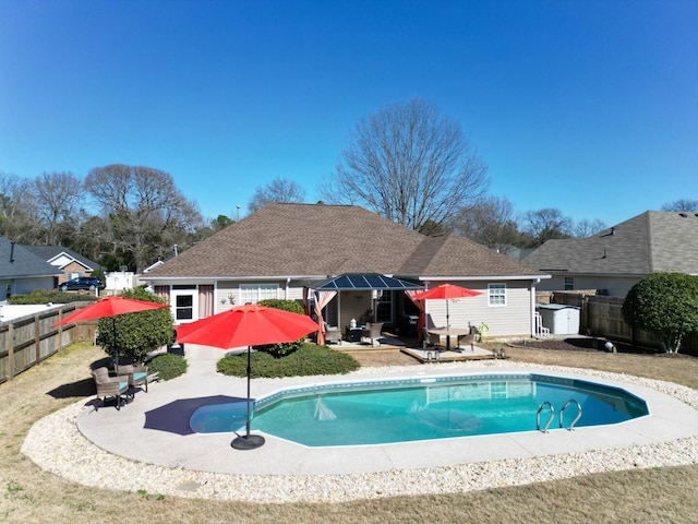 view of swimming pool with a patio