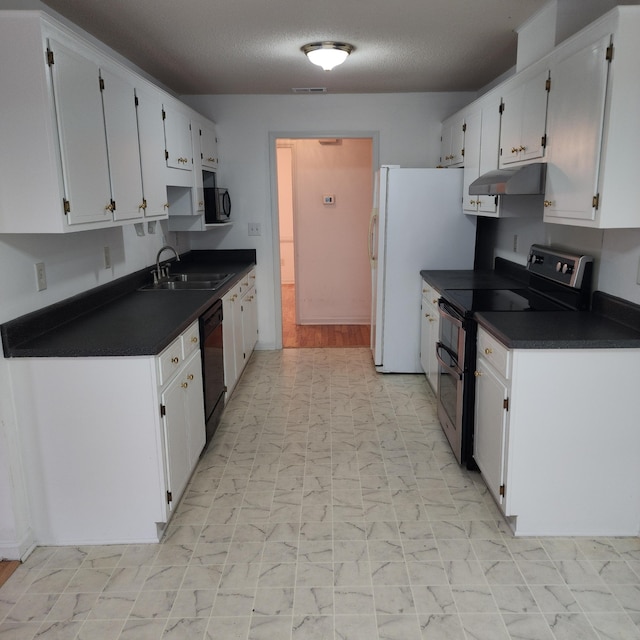 kitchen featuring double oven range, dishwasher, white cabinets, white refrigerator, and sink