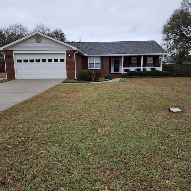 ranch-style home featuring a front yard, a garage, and a porch