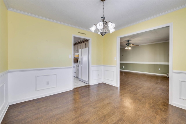 spare room featuring hardwood / wood-style floors, ceiling fan with notable chandelier, a textured ceiling, and crown molding